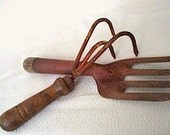 Two old garden hand tools - fork and claw