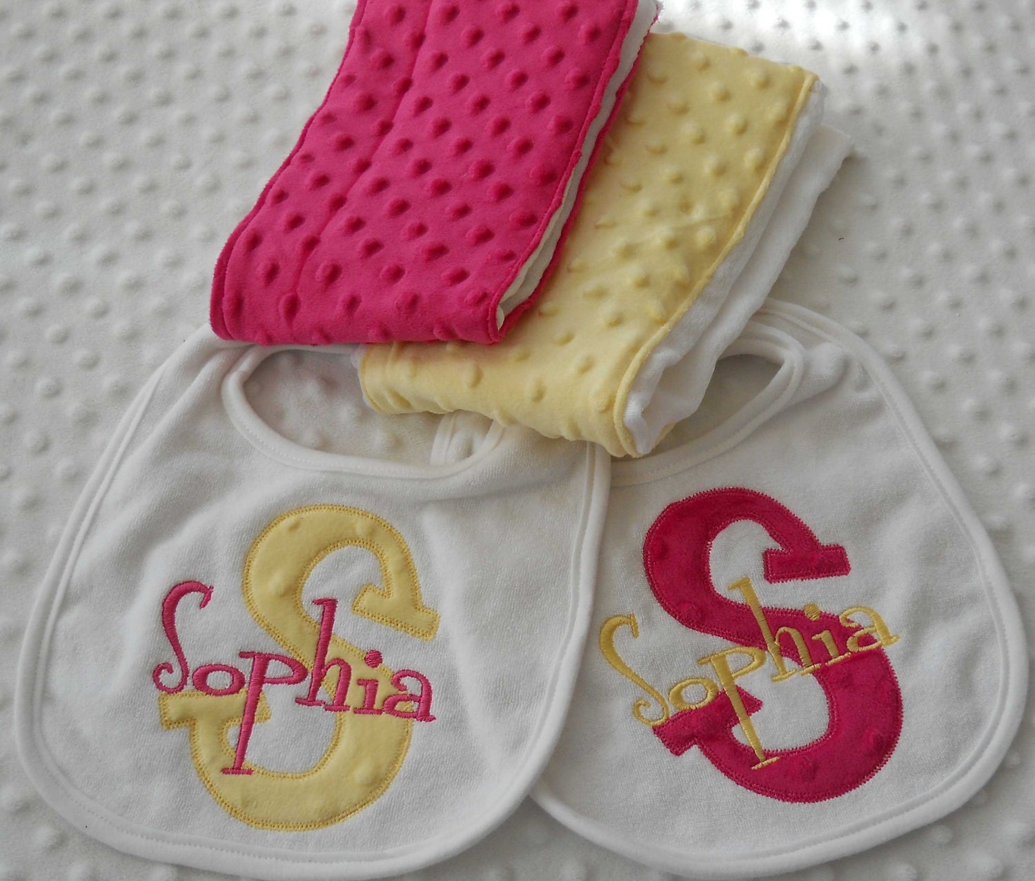 Personalized Gift Set of 2 Baby girl Bibs with Appliqued INiTiaL in MiNKy and embroidered name and 2 minky burp cloths in YeLLoW and PiNK