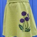 Purple Flowers on a Lime Green Skirt