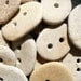 5 BEACH STONE BUTTONS...5 sweet hand drilled beach stones