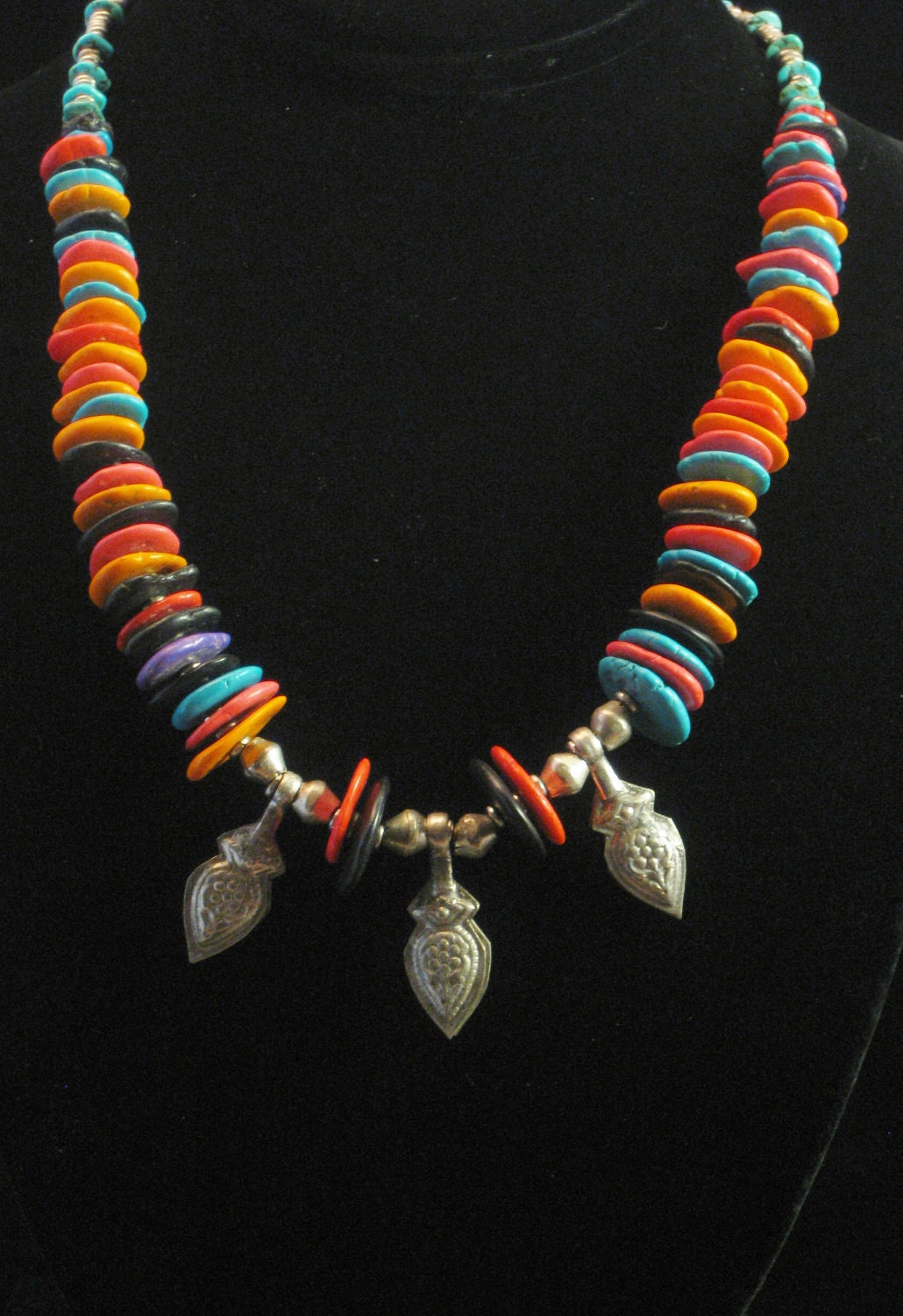 Necklace:  Dyed, multicolor turquoise beads with Afghani amulets and Ethiopian bicone and ring breads