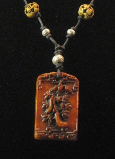 Necklace: Asian carved jade pendant with sterling silver and carved bone beads