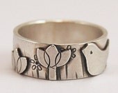 Tiny bird in the flower garden - ring