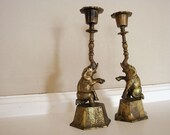 Unique pair of vintage Chinese hand engraved kneeling and smiling baby elephant brass candle sticks