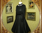 80s black sheer dress. sequin neckline and waist. sz m.