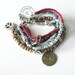Bohemian hippie friendship gypsy bracelet of turquoise, pink and grey with multiple rows of beads