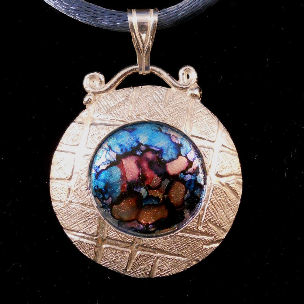 silver pendant circle pendant reversible pendant floral motif on front tide pool on back
