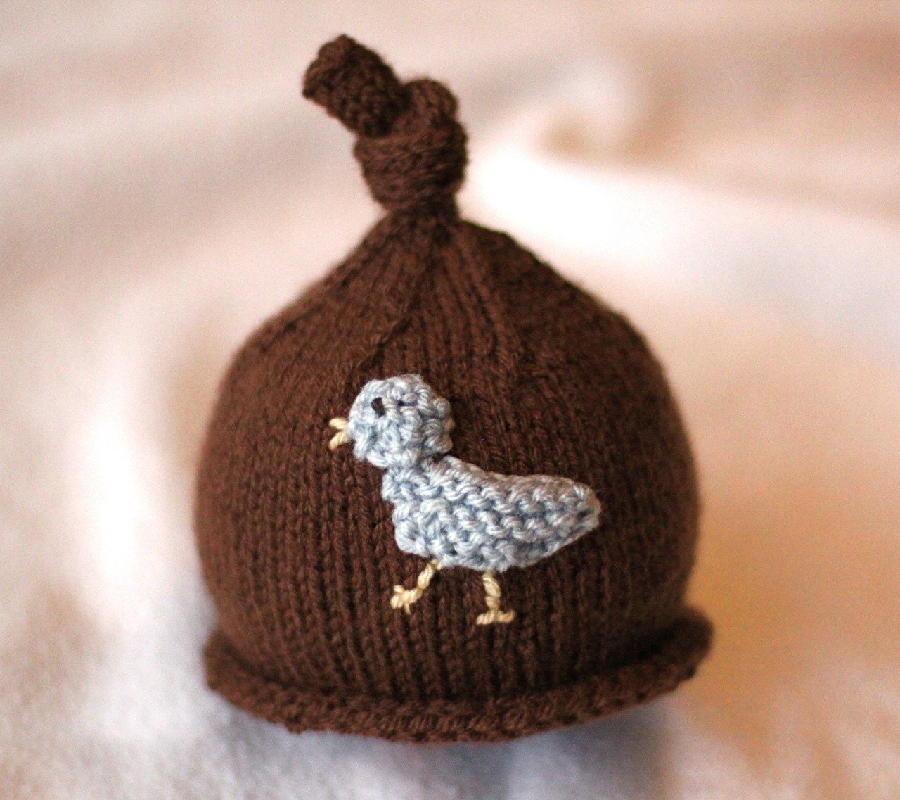 Baby girl or boy knit hat with bird applique.  Sizes newborn to big kid available.