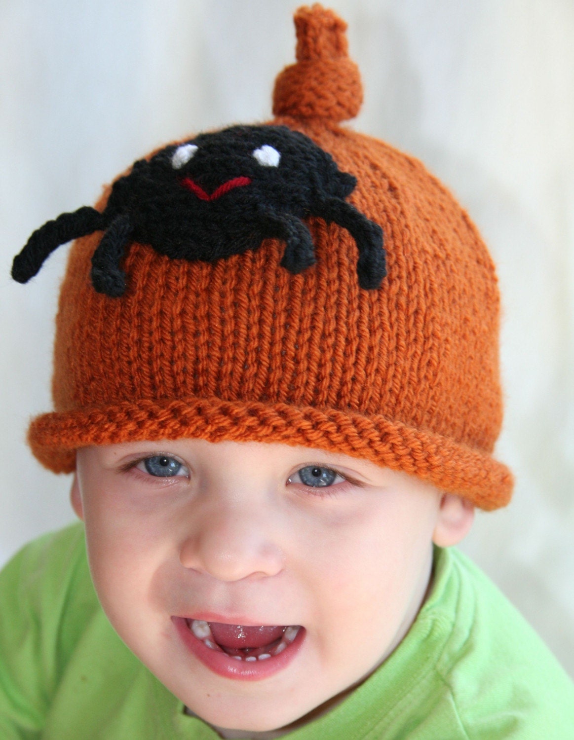 baby boy or girl knit hat with spider applique.  sizes newborn to big kid available.  halloween