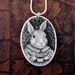 Original scrimshaw bunny rabbit on ivory pendant with coffee