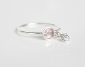 sterling silver with 5mm.pale pink cabochon tourmaline and 3mm.colorless zirconia, 71/2 sized stacking ring, handmade, one of a kind