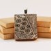 Recycled Scrabble Game Tile Pendant Land of the Rising Graphic