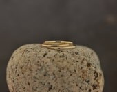 Three 14k gold thin stacking bands