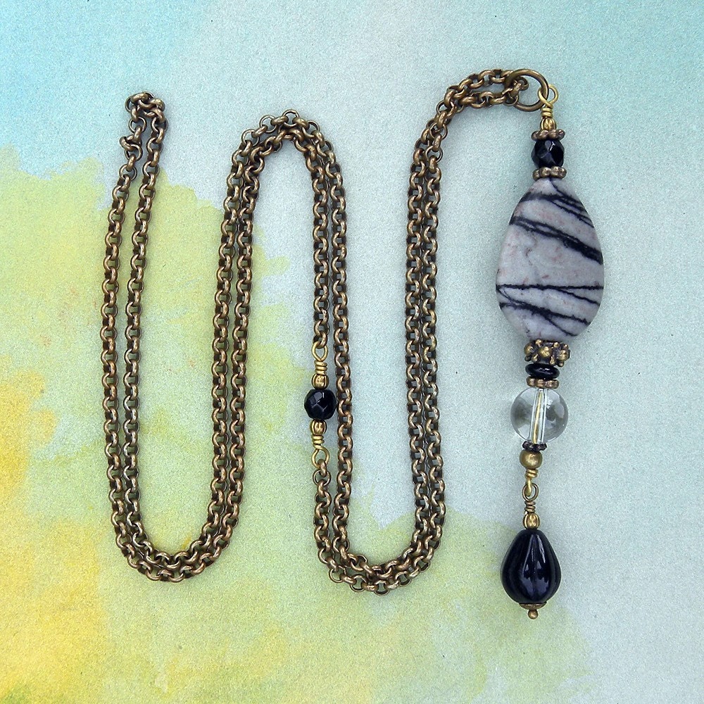 Composite pendant on a long chain necklace