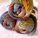 Wool blend yarn, Red Heart Boutique Treasure yarn in Horizon, subtle shades of mauve, red and blues, worsted weight