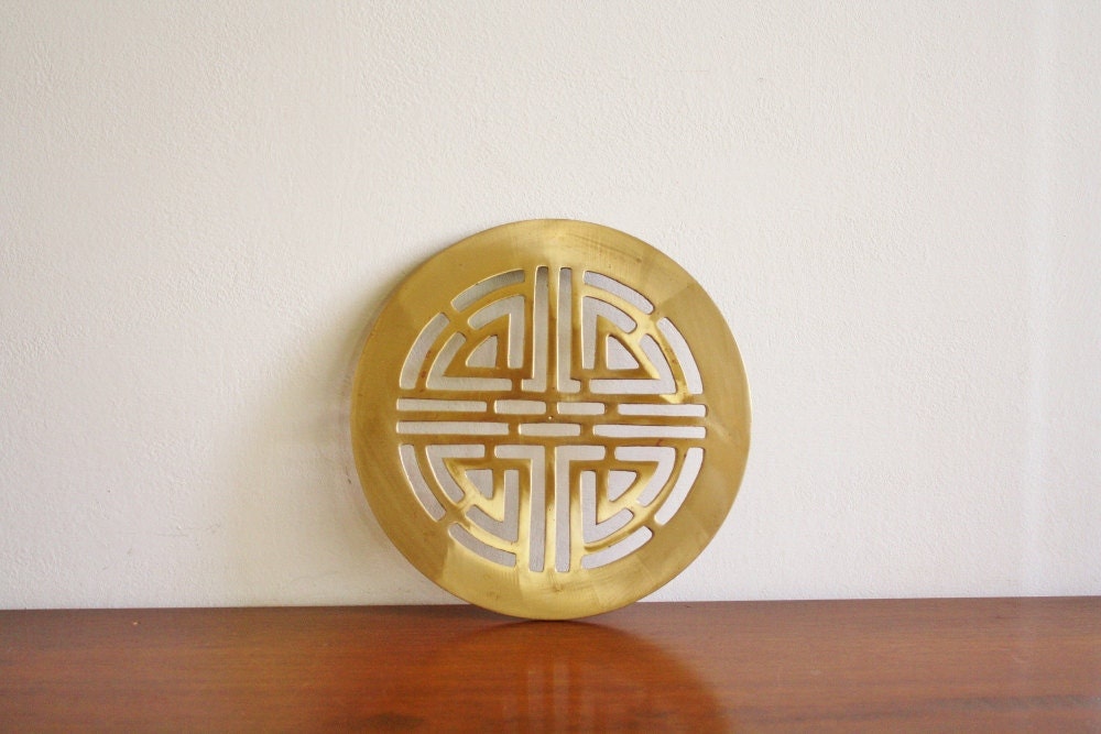Vintage brass Asian style trivet