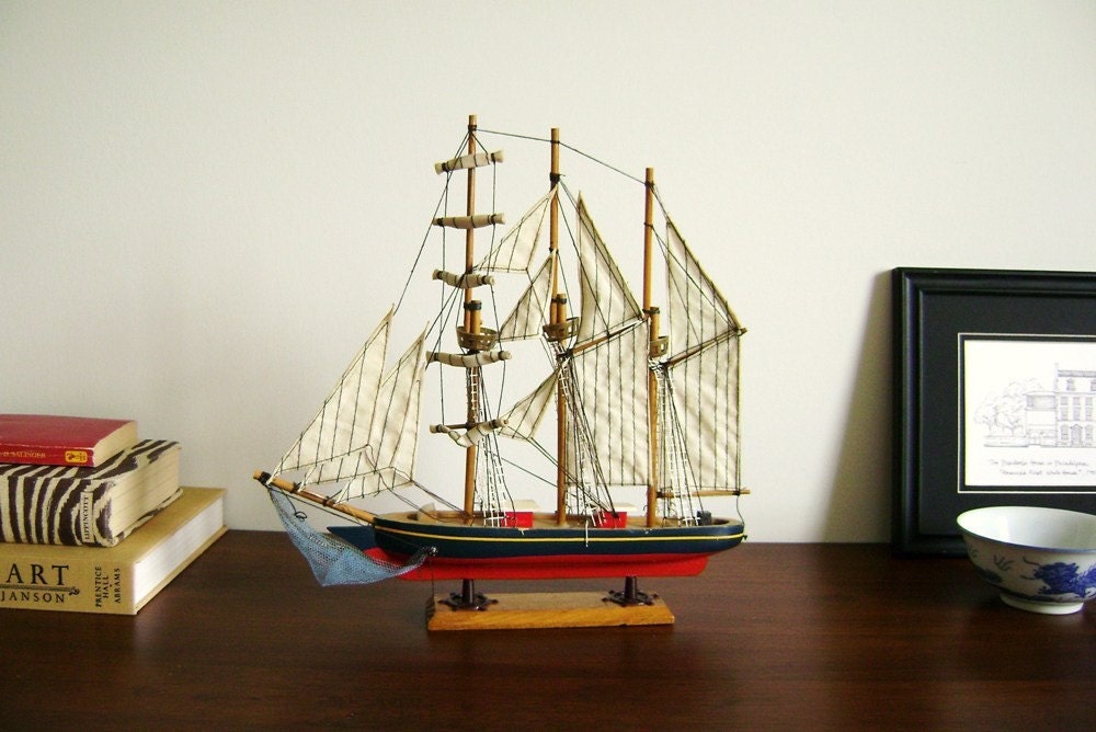 Vintage model sailboat, wood base ship, white, red with linen sails