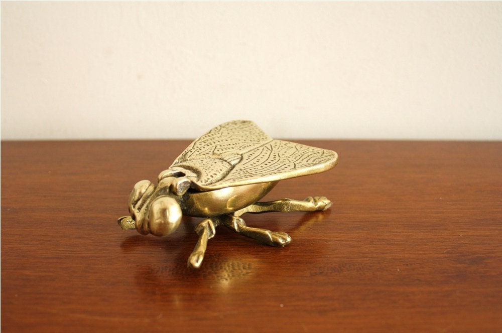 Vintage brass fly with flip up wings, England