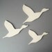 Flock ceramic wall art set of three flying ducks sizes C D and E