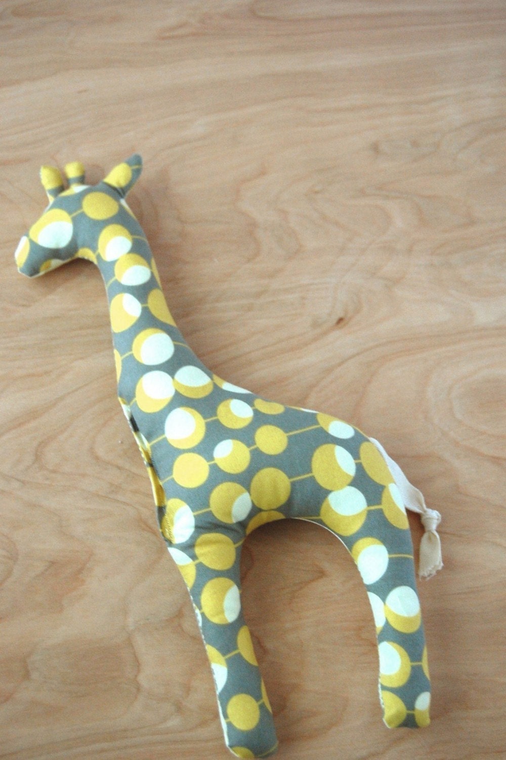 giraffe stuffed toy. grey and mustard