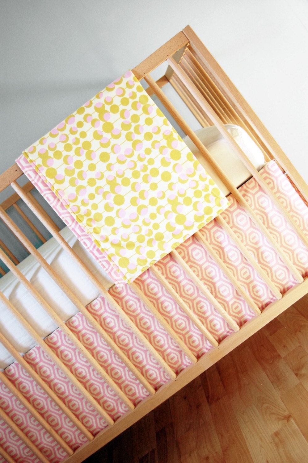 crib set. pink and mustard