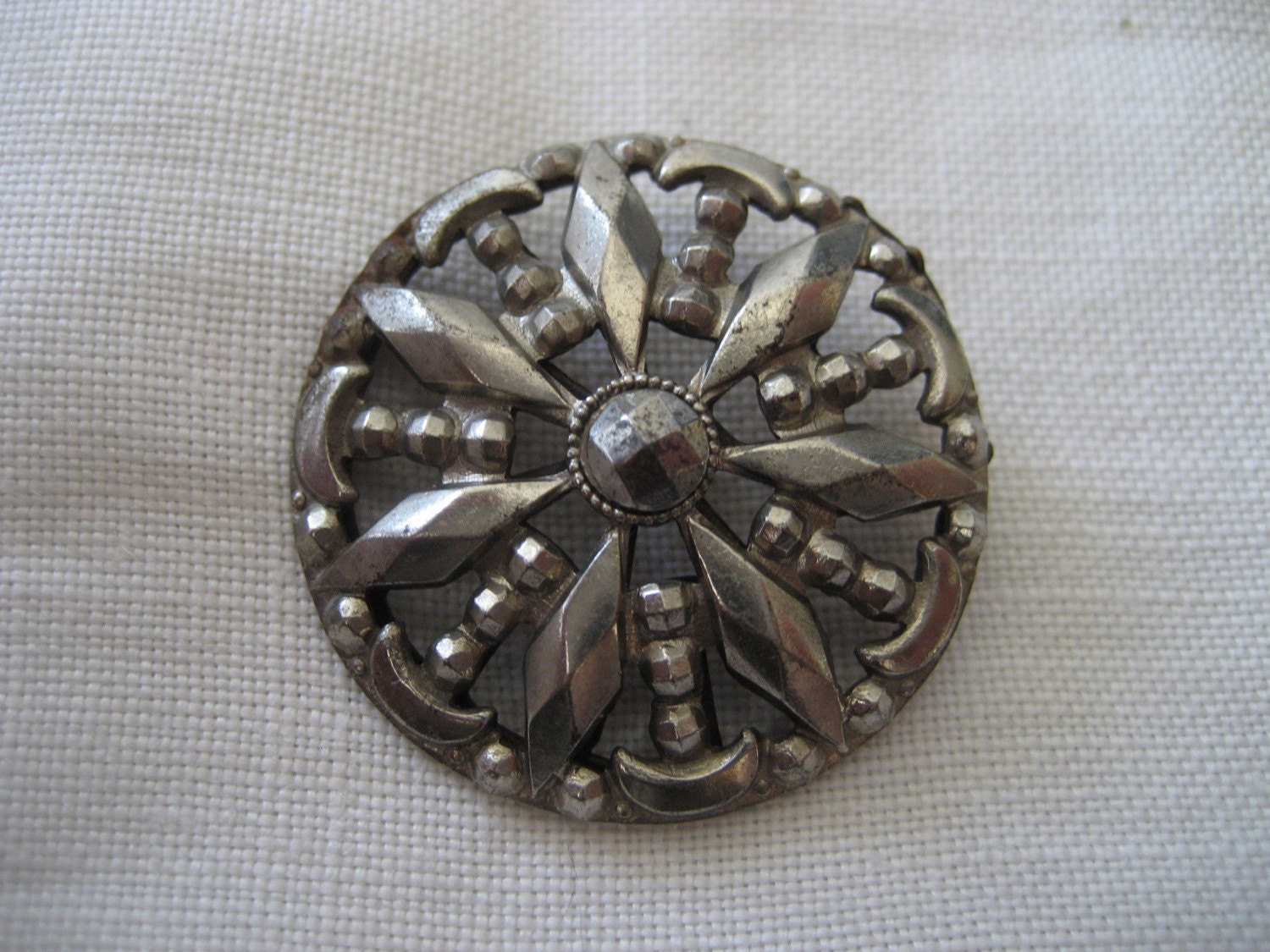 ANTIQUE METAL CUT STEEL RAY AND CRESCENT MOONS BUTTON