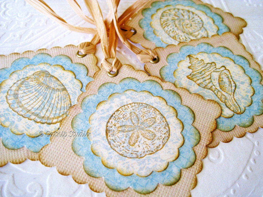 Seashell Tags hand stamped seashells soft blue khaki sand sepia brown raffia ties