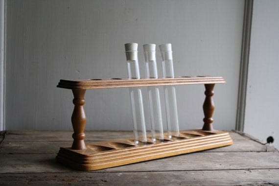 vintage wooden rack with test tubes