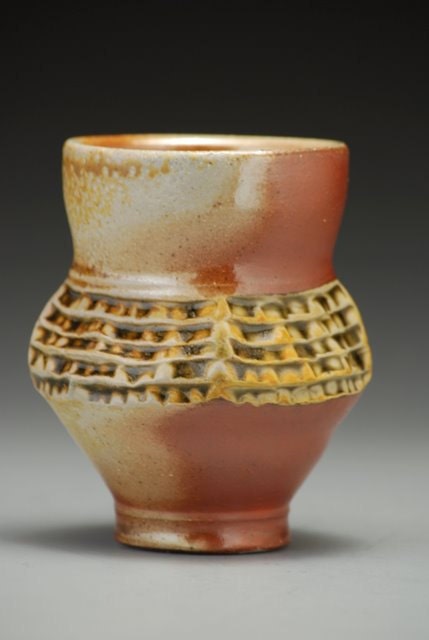 Cup, ridge textures, earth tones, wood and soda fired stoneware