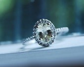Oval Champagne yellow unheated sapphire halo diamond ring