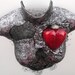 ENTANGLED mixed media female torso in silver and black with red glass heart