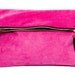 Oversized leather fold clutch in fuchsia with black detailing