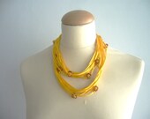 Yellow Satin and textured beads necklace