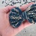 My Blue Bow - Hand knit hair clip in navy blue and khaki multicolor yarn
