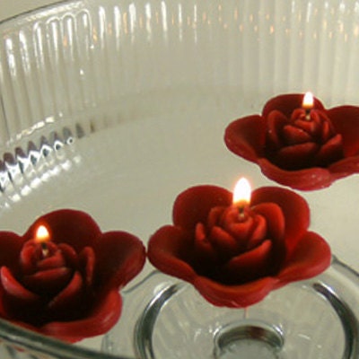 12 Burgundy floating rose wedding candles for table centerpiece and reception decor.