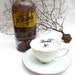 Gothic Poison tea cup and saucer Vintage altered plate Chase and Scout Hemlock