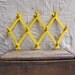 vintage c. 1960s yellow accordion rack