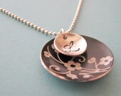 black and silver patterned monogram necklace