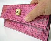 Personalized vinyl clutch or wallet.  You pick color card stock and scrabble tile.  Get well gift