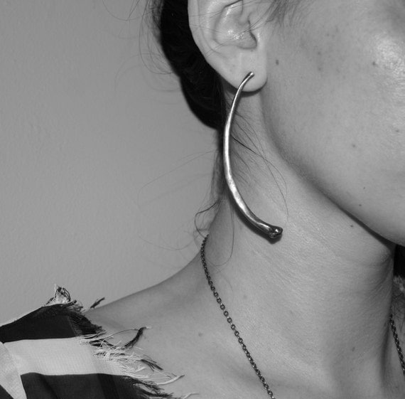 forget me not. snake rib earrings.