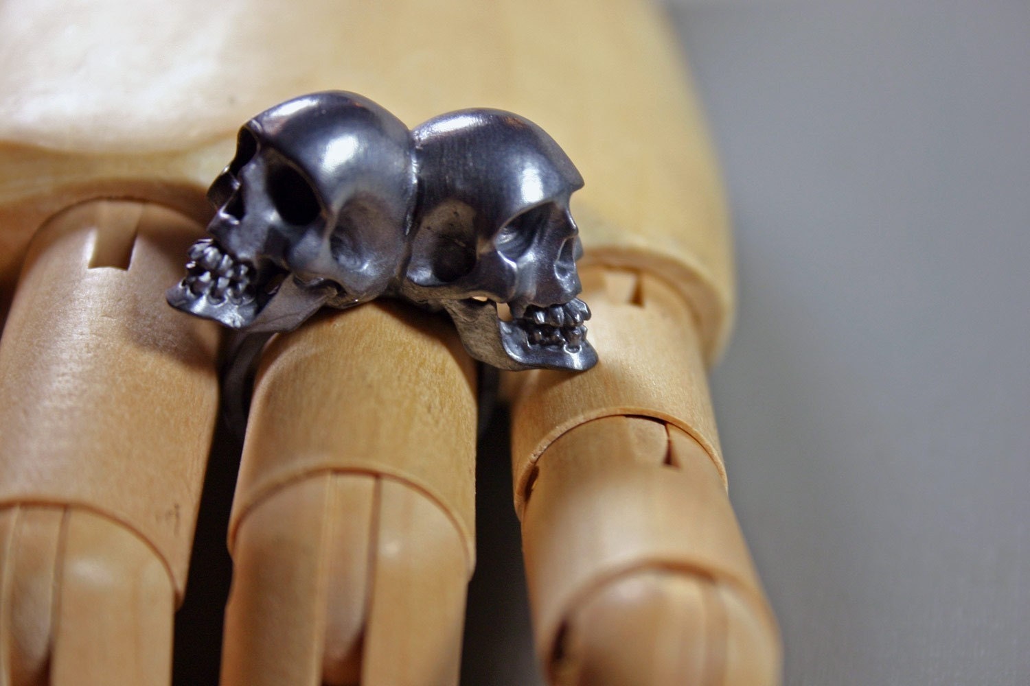 one of us. conjoined twin skull ring. sterling silver.
