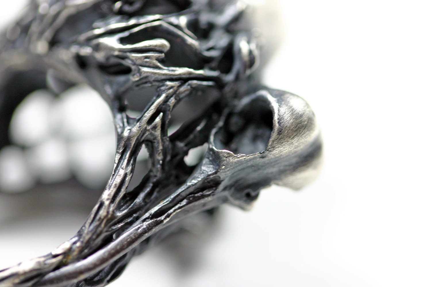 nesting in the underworld. cast crystal and hummingbird skull ring.