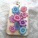 multi colored flower polymer clay cane slices in resin pendant
