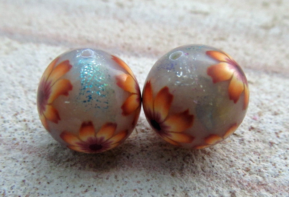 orange and burgandy flowers over foiled polymer clay round beads