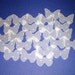 25 butterfly shaped punch-outs in dotted design velum