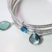 Silver Bangle with Blue Sparkly Bezel Set Charms