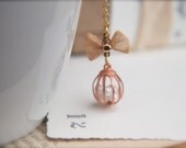 Caged Innocence. A tiny vintage cage and mesh bow necklace.