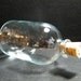 Glass bottle: 1 domed glass bottle with a natural cork, holds 100ml, supplies