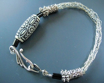 Viking knitted bracelet perfect for a  gift - with silver wire and black and white ethenic bead under 40 USD
