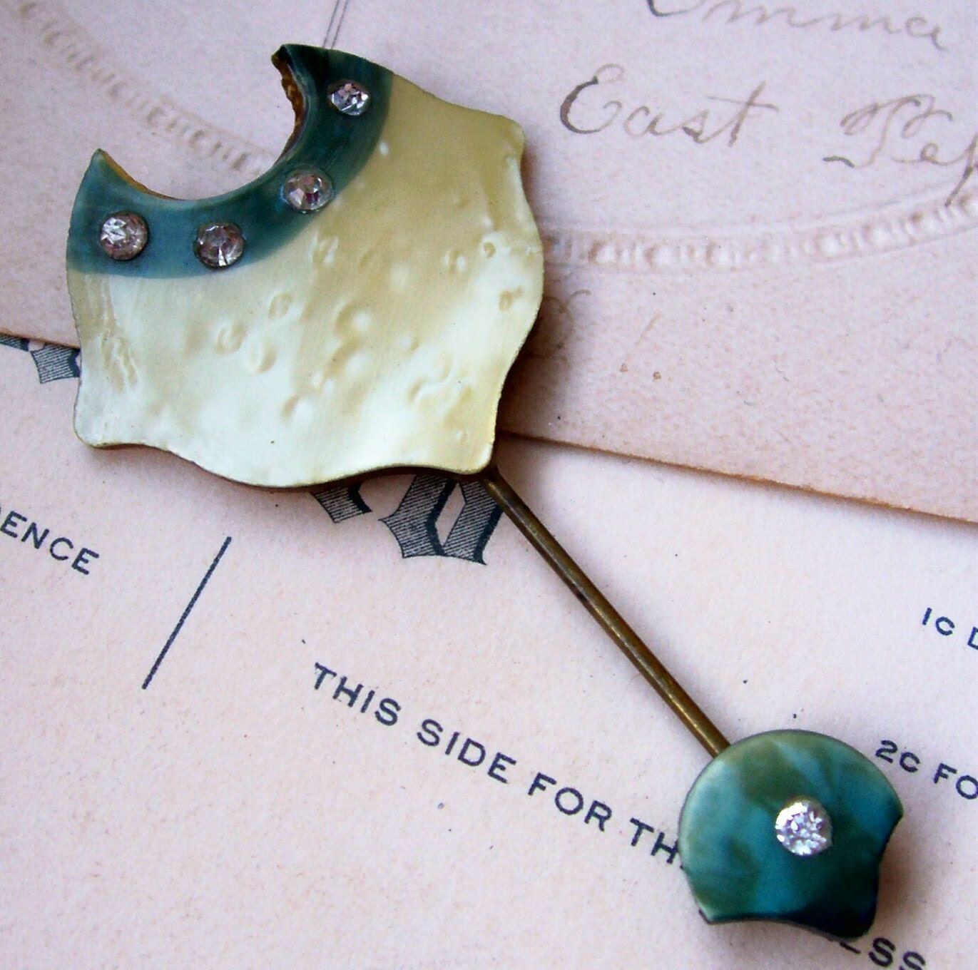 Vintage green yellow celluloid and rhinestone stick hat pin